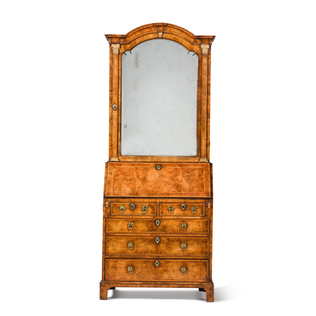 View full screen - View 1 of Lot 130. A George I walnut and parcel-gilt bureau cabinet, circa 1725.