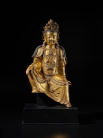 A large gilt-bronze figure of seated Avalokiteshvara, Late Ming dynasty