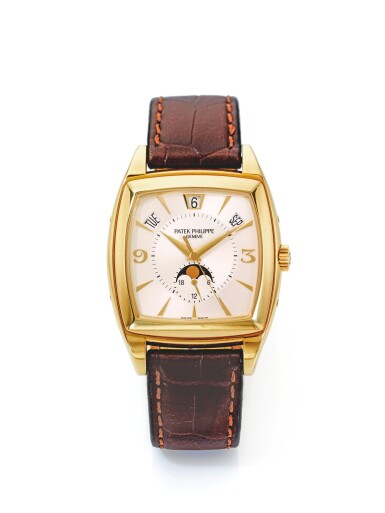 View full screen - View 1 of Lot 151. PATEK PHILIPPE | REF 5135J GONDOLO CALENDARIO, A YELLOW GOLD TONNEAU FORM AUTOMATIC ANNUAL CALENDAR WRISTWATCH WITH MOON PHASES MADE IN 2005.