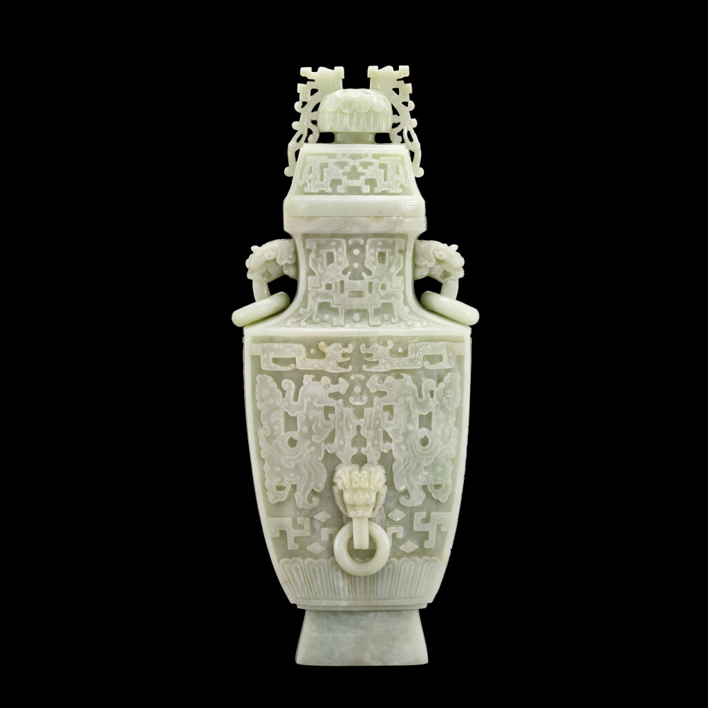View full screen - View 1 of Lot 117. A large white jade archaistic vase and cover, fanglei | 白玉浮雕仿古龍紋瑞獸活環耳蓋壺.