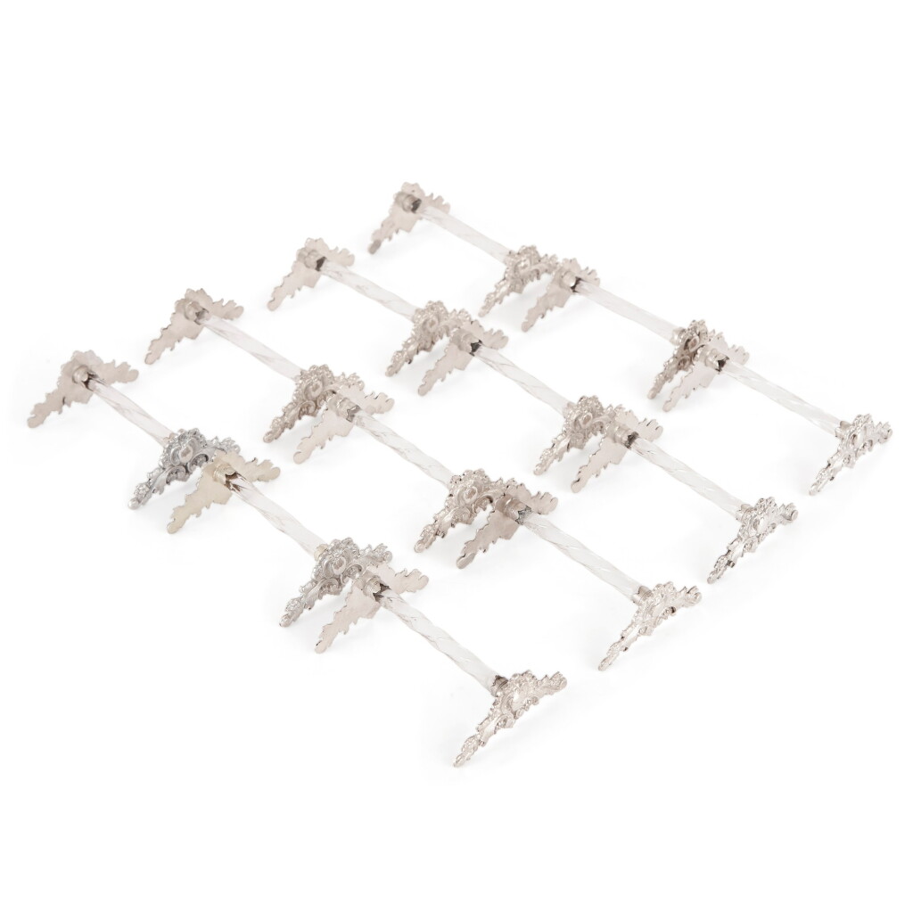 View full screen - View 1 of Lot 66. A SET OF TWELVE FRENCH SILVER-MOUNTED GLASS KNIFE RESTS, 19TH CENTURY.