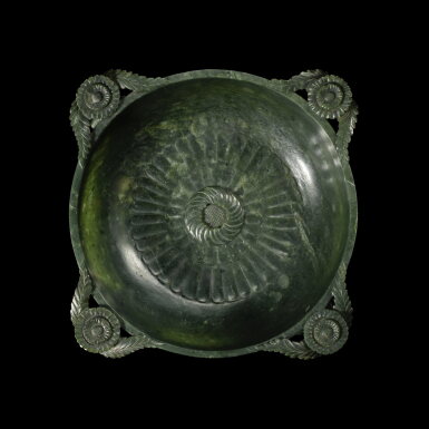 View full screen - View 1 of Lot 300. A Mughal-style spinach-green jade 'chrysanthemum' bowl, Qing dynasty, 19th century | 清十九世紀 碧玉雕痕都斯坦式花耳菊瓣洗.