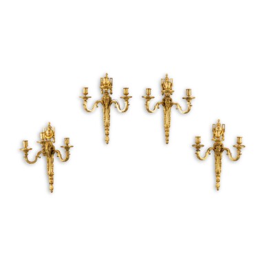 View full screen - View 1 of Lot 281. A set of four Louis XVI gilt-bronze three-light wall-lights, circa 1780 | Suite de quatre appliques à trois lumières en bronze doré d'époque Louis XVI, vers 1780.
