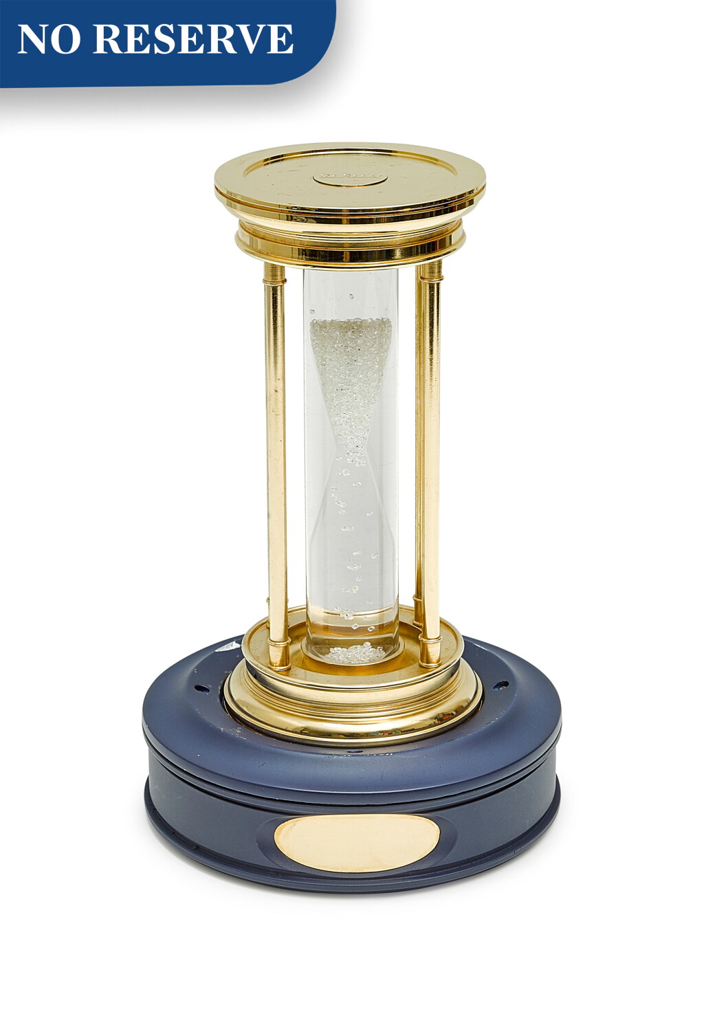View full screen - View 1 of Lot 8111. DEBEERS | A GILT BRASS HOURGLASS WITH FLOATING DIAMONDS, CIRCA 2000.