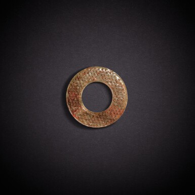 View full screen - View 1 of Lot 7873. A pale celadon and russet jade disc, huan, Eastern Zhou dynasty, Warring States period | 東周戰國 青白玉穀紋環.