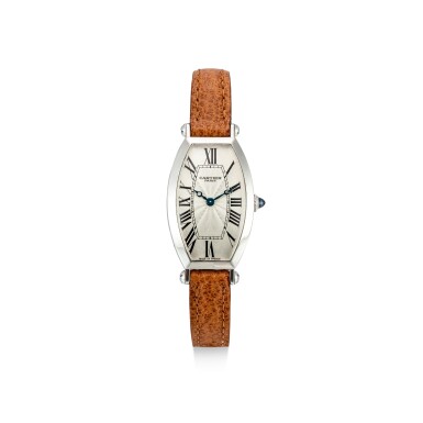 View full screen - View 1 of Lot 602. CARTIER | TONNEAU, REFERENCE 2555C, A PLATINUM WRISTWATCH, CIRCA 2000.