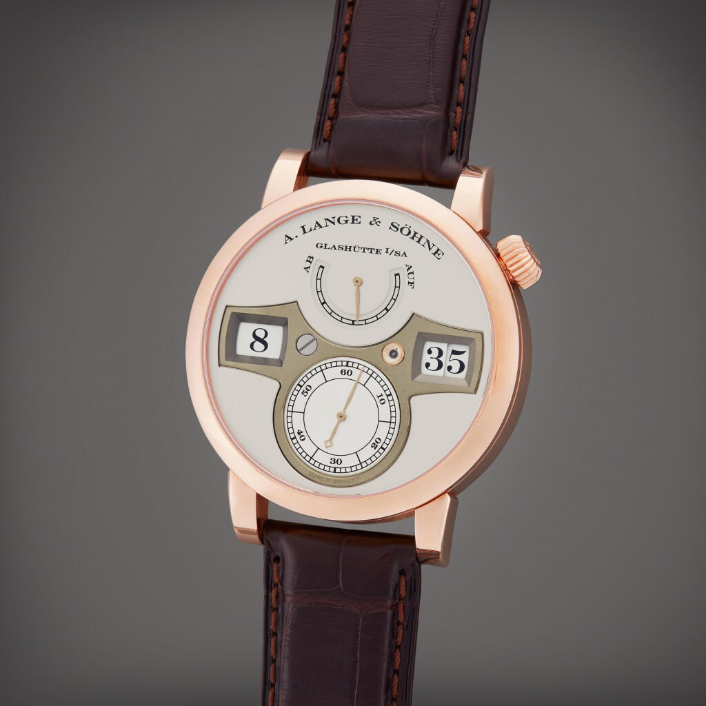 View full screen - View 1 of Lot 8. Zeitwerk | A pink gold wristwatch with digital display and power reserve indication, Circa 2010.