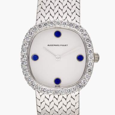 View full screen - View 1 of Lot 385. A white gold, diamond and lapis lazuli-set bracelet watch, Circa 1980.