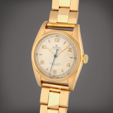 View full screen - View 1 of Lot 326. 'Bubbleback', Reference 5050 | A yellow gold wristwatch with bracelet | Circa 1949.