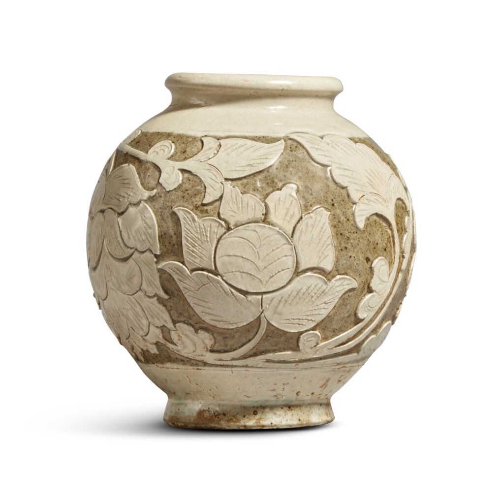 View full screen - View 1 of Lot 186. A 'Cizhou' sgraffiato 'floral' ovoid vase, Jin dynasty | 金 磁州窰白釉剔花罐.