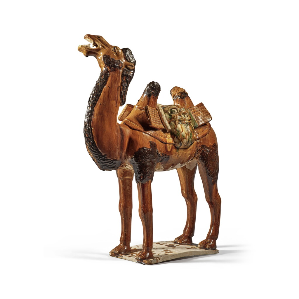 View full screen - View 1 of Lot 180. A sancai-glazed pottery figure of a camel, Tang dynasty | 唐 三彩駱駝.