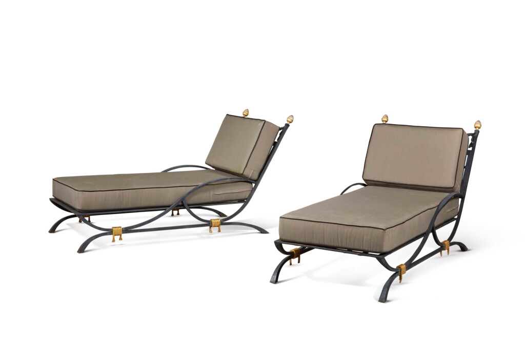 View full screen - View 1 of Lot 191. A Pair Grey/Black Painted and Parcel Gilt Wrought Iron Deck Chairs, Supplied by JP Molyneux Studio Ltd.