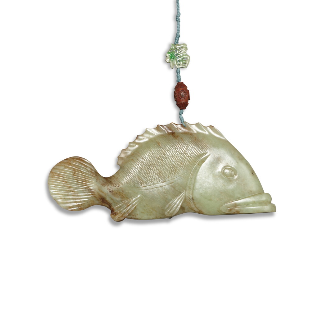 View full screen - View 1 of Lot 839. A large celadon jade fish, Yuan dynasty | 元 青玉魚.