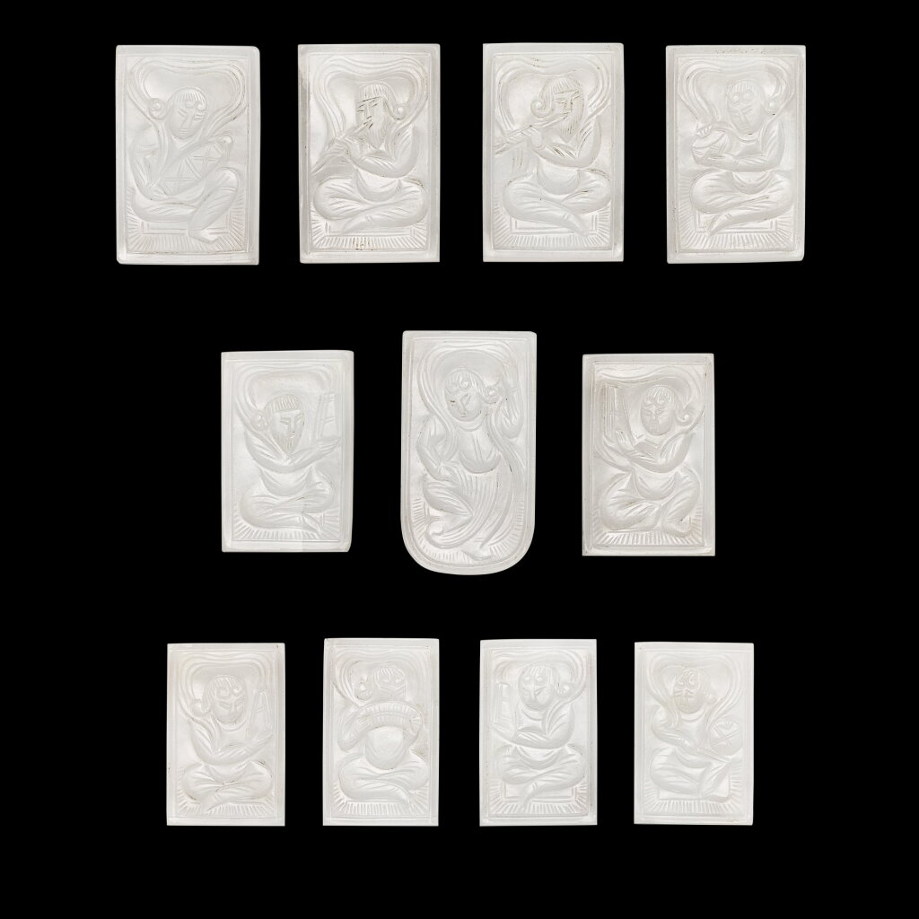 View full screen - View 1 of Lot 319. A set of eleven white jade ‘musicians and dancers’ belt plaques, Tang dynasty 唐 白玉雕伎樂紋帶珮一組十一件.