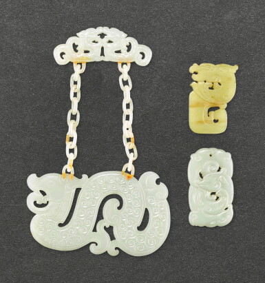 View full screen - View 1 of Lot 606. TWO JADE ARCHAISTIC PLAQUES AND A WHITE JADE SUSPENDED ARCHAISTIC PLAQUE QING DYNASTY | 清 玉珮飾一組三件.