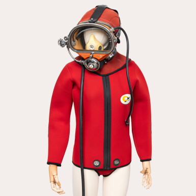 View full screen - View 1 of Lot 203. A very rare set of deep sea diving equipment consisting of a wet suit and an injection molded diving mask with face seal, Circa 1980 .