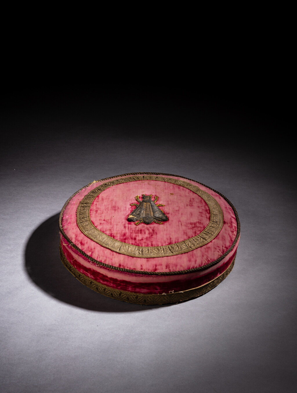 View full screen - View 1 of Lot 15. A French Empire wooden and purple velvet footrest, circa 1805.