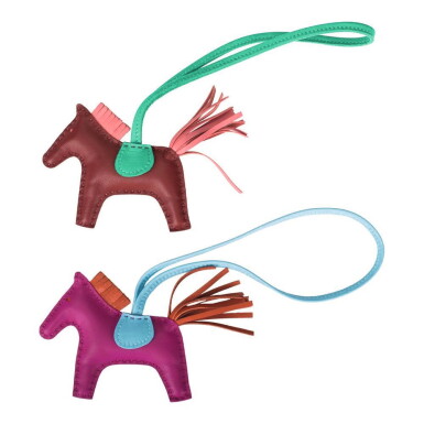 View full screen - View 1 of Lot 12. Hermès Set of Two Grigri Rodeo Bag Charms Size PM.