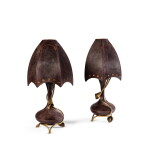 A pair of gilt-metal mounted tinted glass lamps, circa 1900