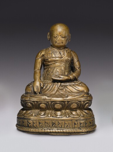 View full screen - View 1 of Lot 328. A COPPER ALLOY FIGURE OF A LAMA WITH COPPER INLAY, TIBET, 16TH CENTURY .