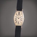 Tonneau | An early platinum and gold tonneau shaped wristwatch, Owned by Al Jolson and Gifted to Dr. Leo Winter, Circa 1920
