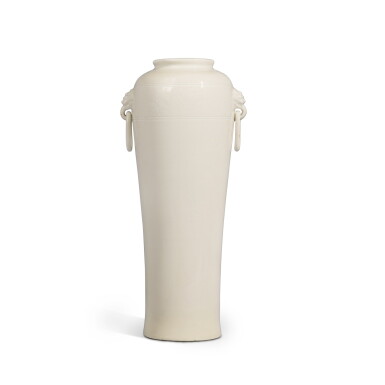 View full screen - View 1 of Lot 322. An incised 'Dehua' sleeve vase, Qing dynasty, 17th / 18th century | 清十七 / 十八世紀 德化白釉鋪首耳筒瓶.