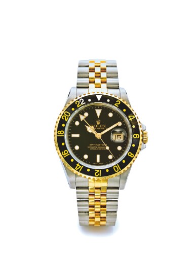 View full screen - View 1 of Lot 8. ROLEX | REF 16713 GMT-MASTER II, A STAINLESS STEEL AND YELLOW GOLD AUTOMATIC DUAL TIME ZONE WRISTWATCH WITH DATE AND BRACELET CIRCA 1990.