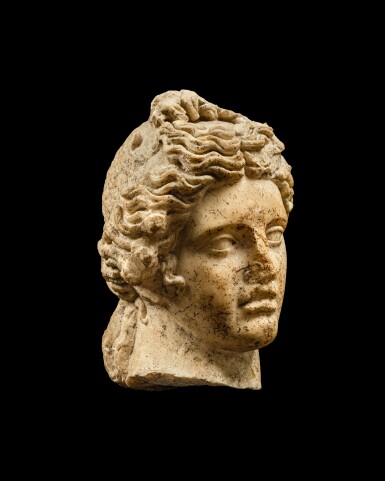 View full screen - View 1 of Lot 57. A Roman Marble Head of Apollo, 1st Century A.D..