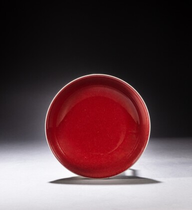 View full screen - View 1 of Lot 147. A red-glazed dish, Seal mark and period of Jiaqing | 清嘉慶 紅釉盤《大清嘉慶年製》款.