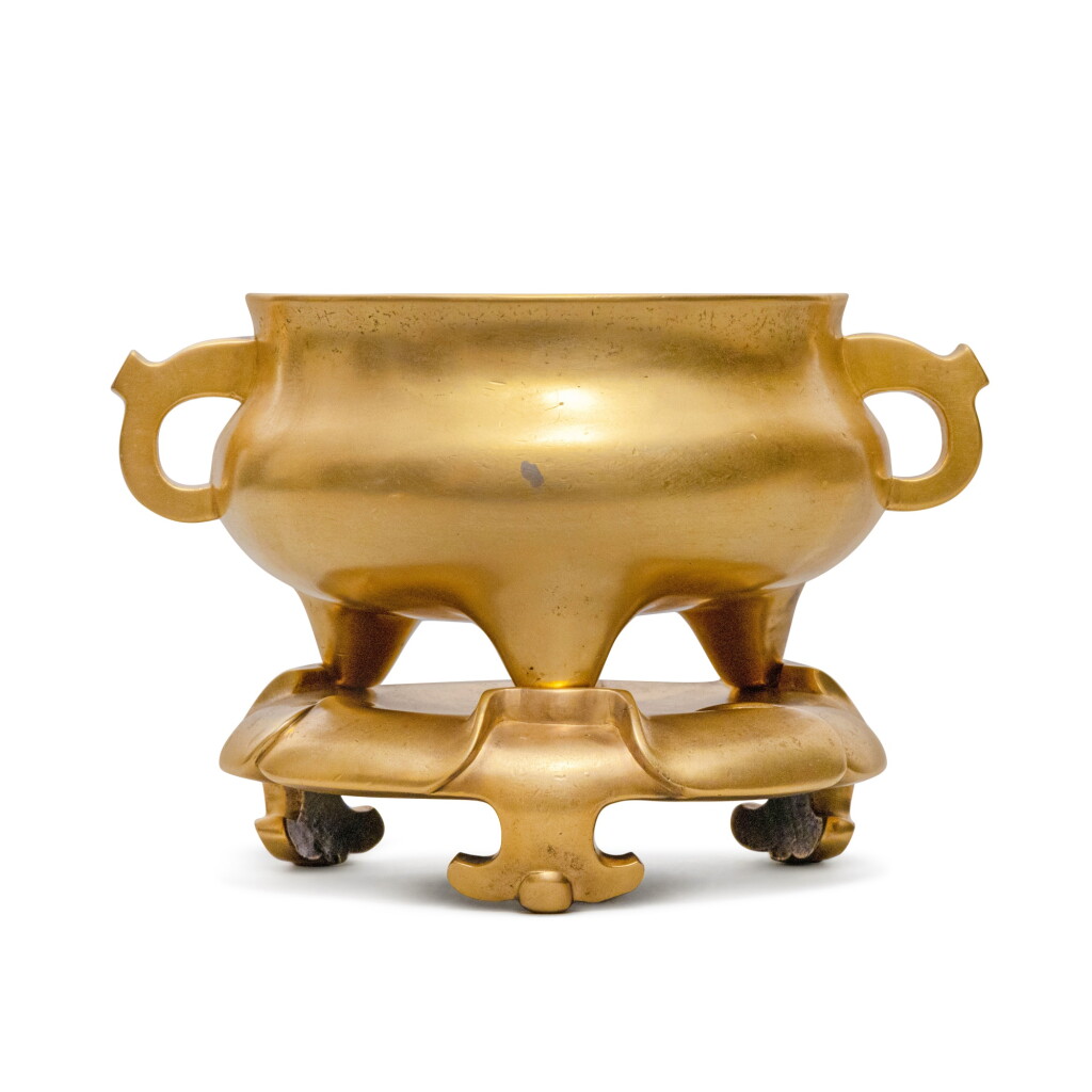 View full screen - View 1 of Lot 114. A gilt-bronze tripod censer and stand.
