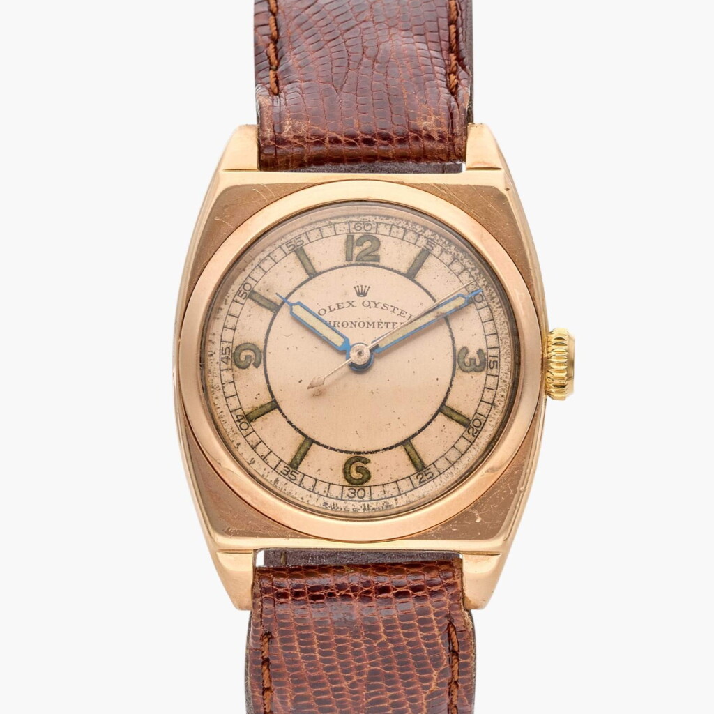 View full screen - View 1 of Lot 407. Reference 3116 | A pink gold gold cushion-shaped wristwatch, Circa 1940.