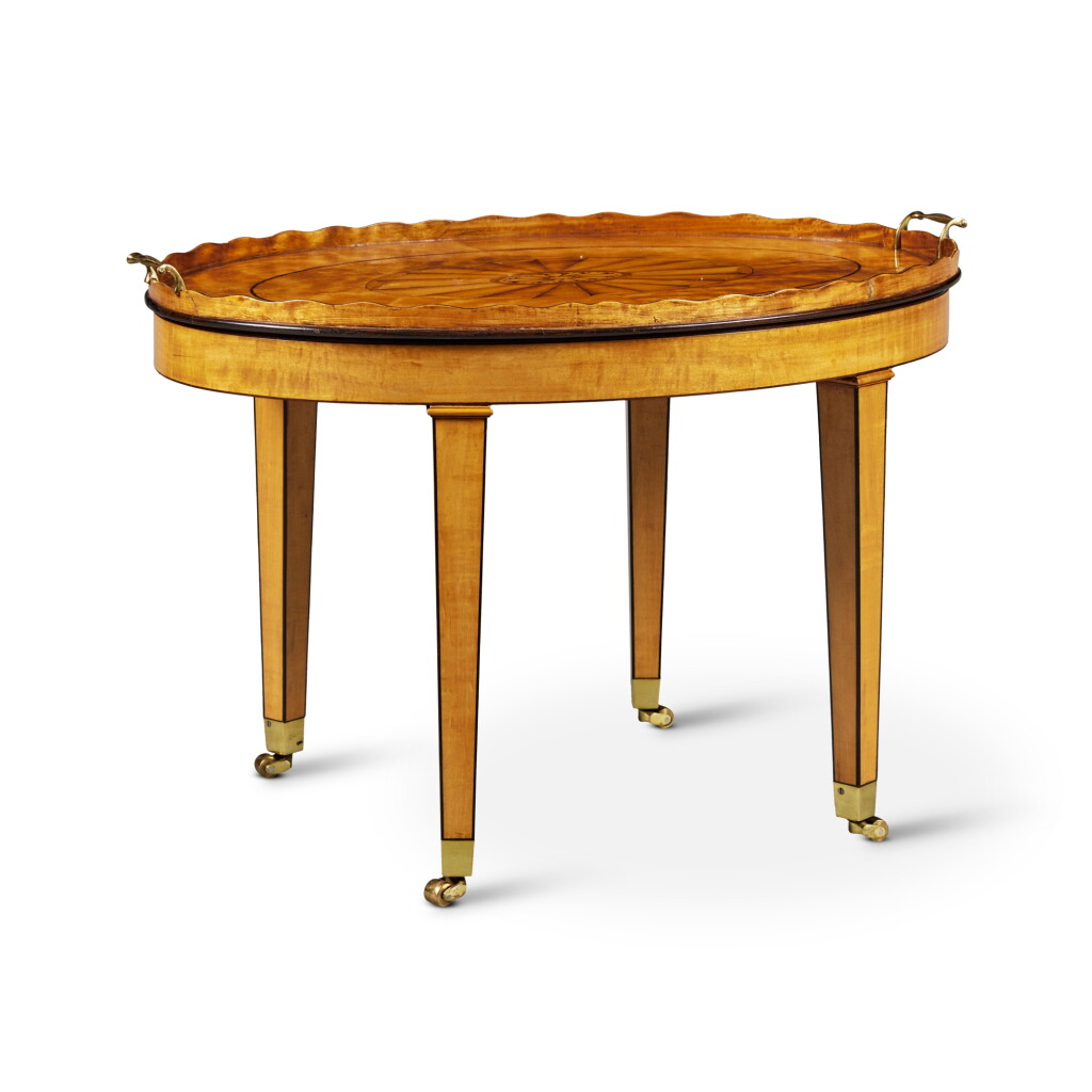 View full screen - View 1 of Lot 518. A George III Ebony and Tulipwood Inlaid Satinwood and Mahogany Tray Table, Last Quarter 18th Century .