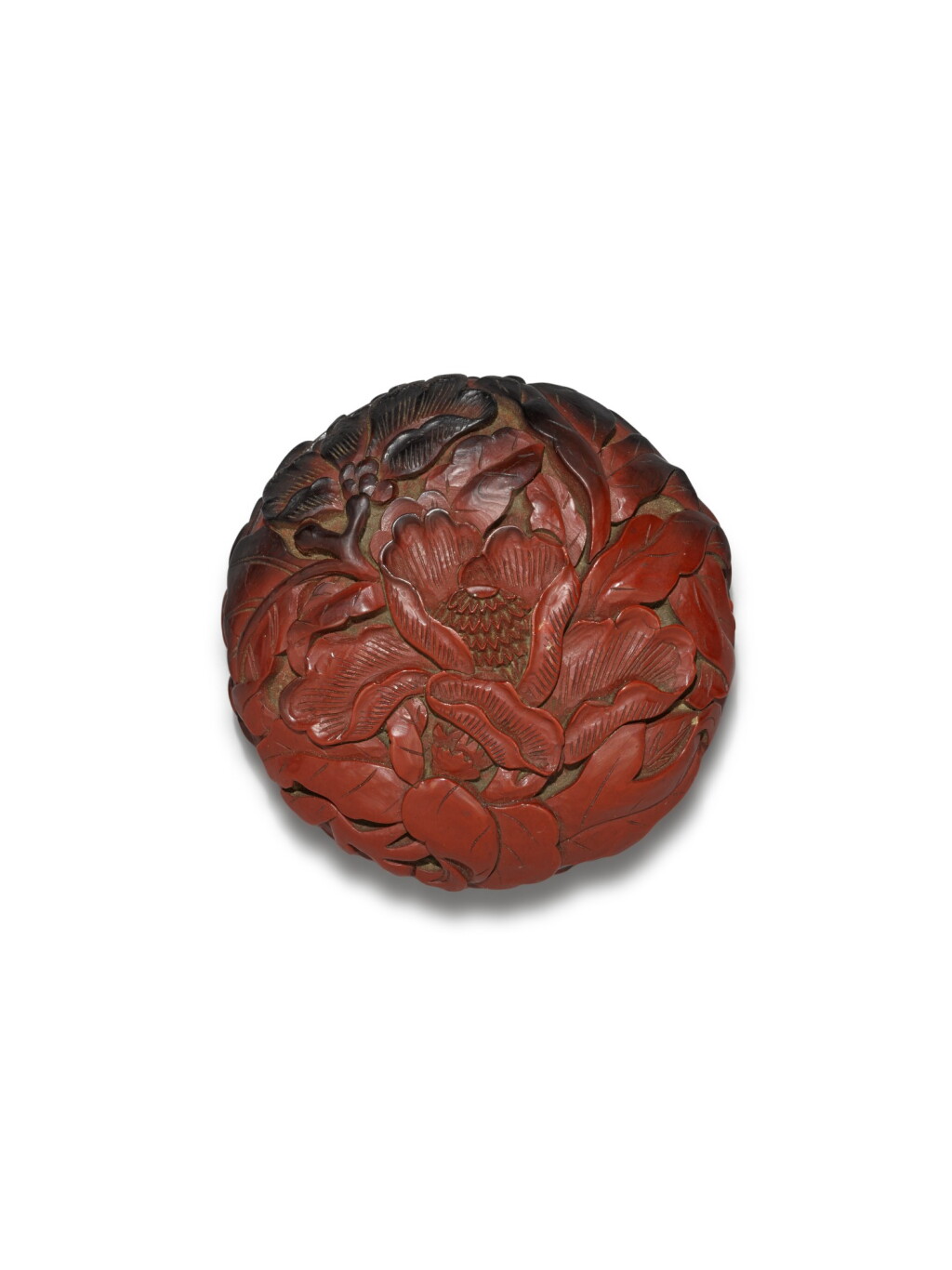 View full screen - View 1 of Lot 29. A carved cinnabar lacquer 'peony' box and cover, Ming dynasty, 16th century | 明十六世紀 剔紅牡丹紋印盒.
