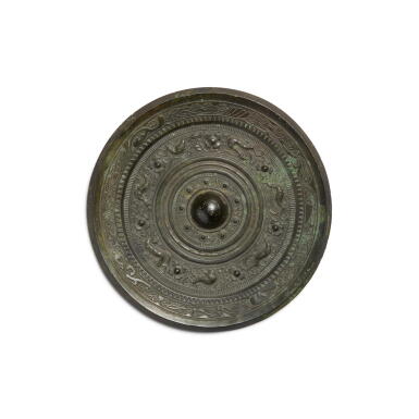 View full screen - View 1 of Lot 793. A bronze 'mythical beast' mirror, Eastern Han dynasty | 東漢 銅瑞獸紋鏡.