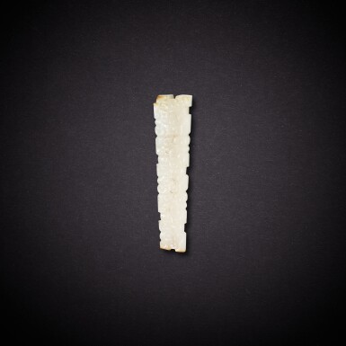 View full screen - View 1 of Lot 7840. A white and russet jade 'dragon' pendant, Eastern Zhou dynasty | 東周 白玉龍紋珮.