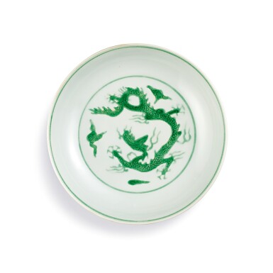 View full screen - View 1 of Lot 3614. A fine and rare incised green-enamelled 'dragon' dish Mark and period of Zhengde | 明正德 白地暗刻海水素胎綠彩雲龍紋盤 《大明正德年製》款.