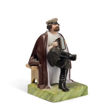 View full screen - View 1 of Lot 131. A Porcelain Figure of an Accordion Player, Gardner Porcelain Factory, late 19th Century.