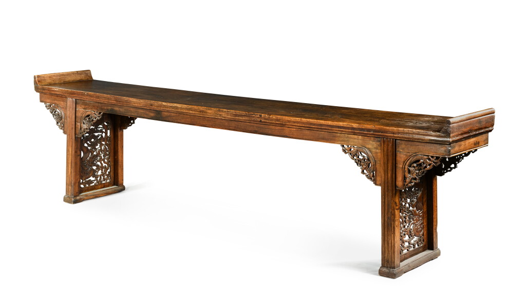 View full screen - View 1 of Lot 421. A monumental walnut 'heitaomu' altar table (Qiaotouan), Qing dynasty, 18th century | 清十八世紀 黑桃木雕雲龍紋翹頭案.