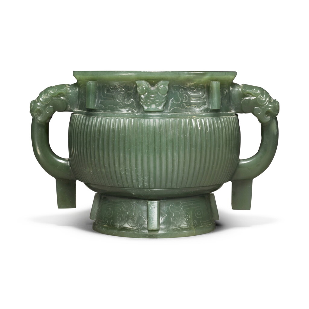 View full screen - View 1 of Lot 85. An archaistic spinach-green jade gui-form censer, Qing dynasty.