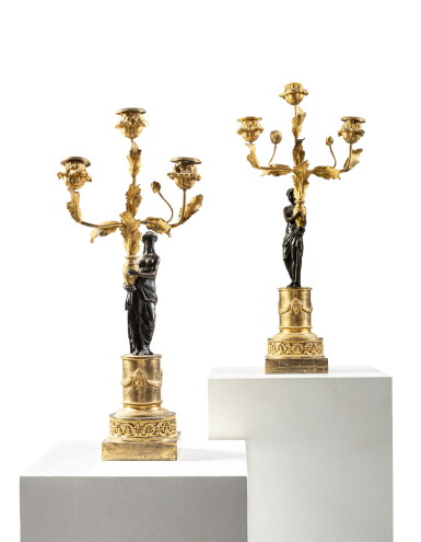 View full screen - View 1 of Lot 159. A pair of Directoire patinated and gilt-bronze three-light candelabra, circa 1800.