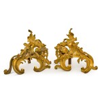 A pair of Louis XV style gilt-bronze chenets, late 19th century