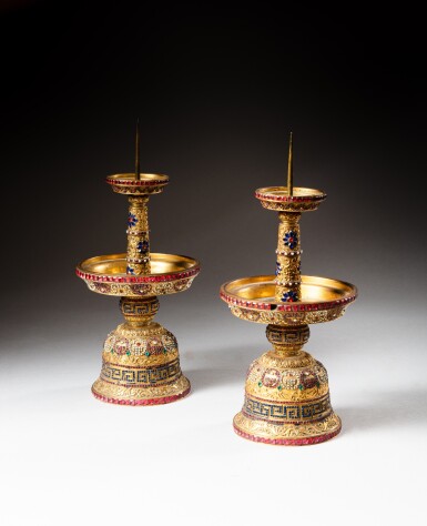View full screen - View 1 of Lot 62. A pair of gilt-bronze and coloured pastes embellished candlesticks, Qing dynasty, Qianlong period | 清乾隆 鎏金銅嵌寳燭臺一對.