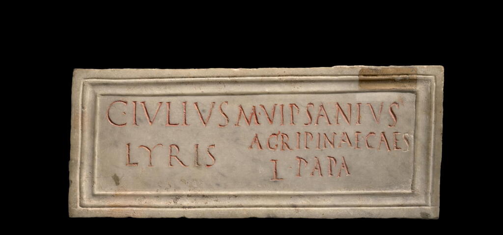 View full screen - View 1 of Lot 258. A ROMAN MARBLE FUNERARY PLAQUE INSCRIBED FOR CAIUS IULIUS LYRIS AND MARCUS VIPSANIUS PAPA, 1ST HALF OF THE 1ST CENTURY A.D..