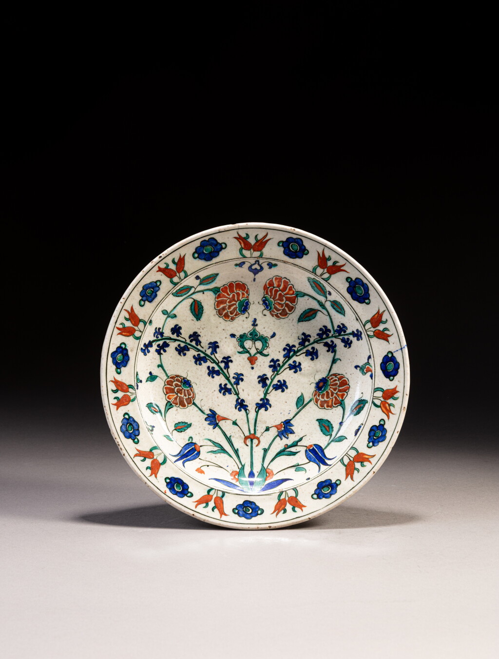 View full screen - View 1 of Lot 110. An Iznik polychrome pottery dish, Turkey, circa 1560-80.