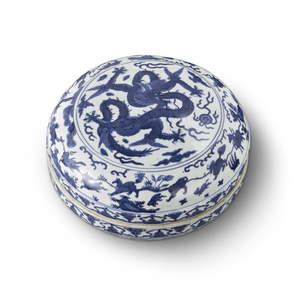 View full screen - View 1 of Lot 69. A rare blue and white circular 'dragon' box and cover, Mark and period of Wanli | 明萬曆 青花雲龍瑞獸紋蓋盒 《大明萬曆年製》款.