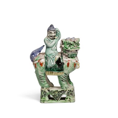 View full screen - View 1 of Lot 15. A rare famille-verte biscuit model of a Mongolian riding a Buddhist lion, Qing dynasty, Kangxi period | 清康熙 五彩胡人騎佛獅擺件.