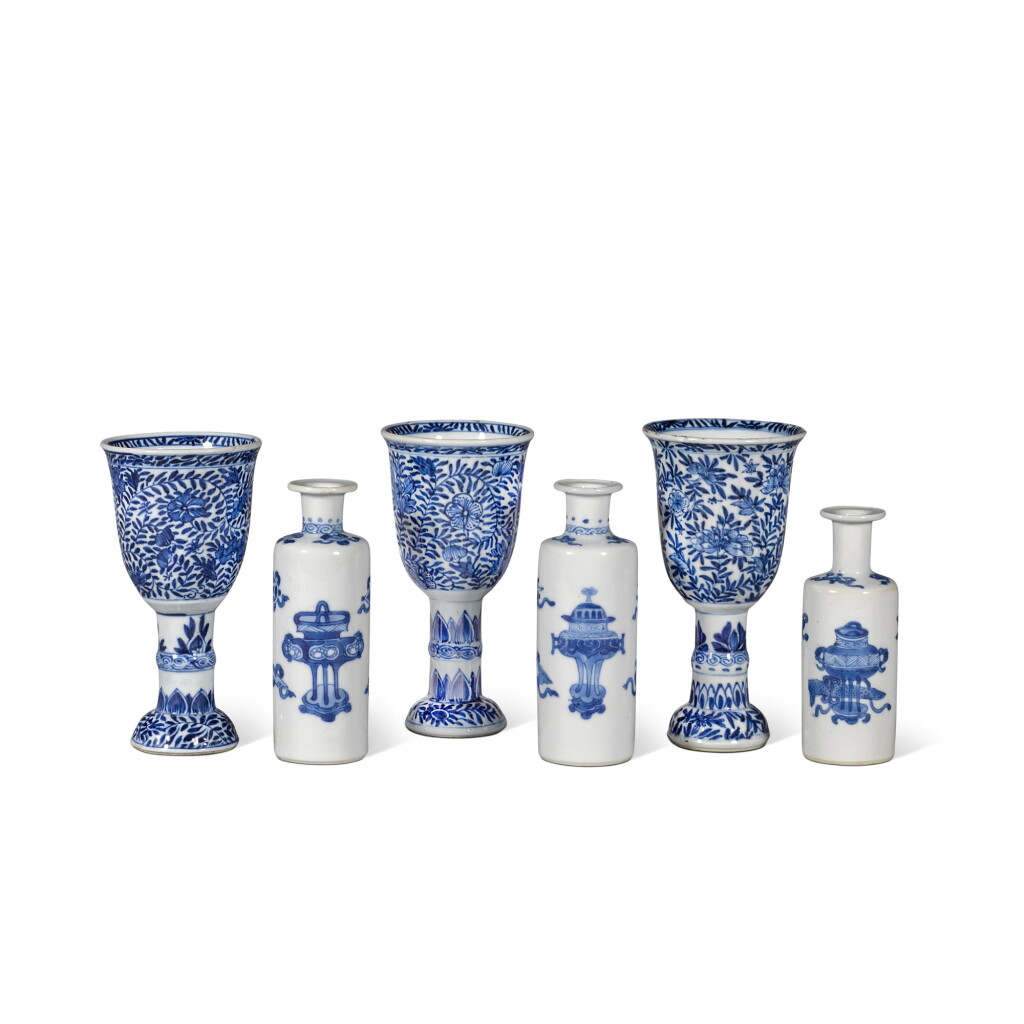 View full screen - View 1 of Lot 368. A group of six small blue and white stem cups and sleeve vases, Qing dynasty, Kangxi | 清康熙 青花花卉紋小高足盃 及 青花八寶紋小棒槌瓶一組六件.
