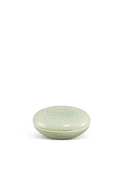 View full screen - View 1 of Lot 3641. A carved celadon-glazed seal paste box and cover, Mark and period of Kangxi | 清康熙 豆青釉刻牡丹紋印泥蓋盒 《大清康熙年製》款.