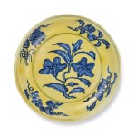 A fine and rare yellow-ground and underglaze-blue 'gardenia' dish, Mark and period of Hongzhi | 明弘治 黃地青花折枝梔子花果紋盤 《大明弘治年製》款