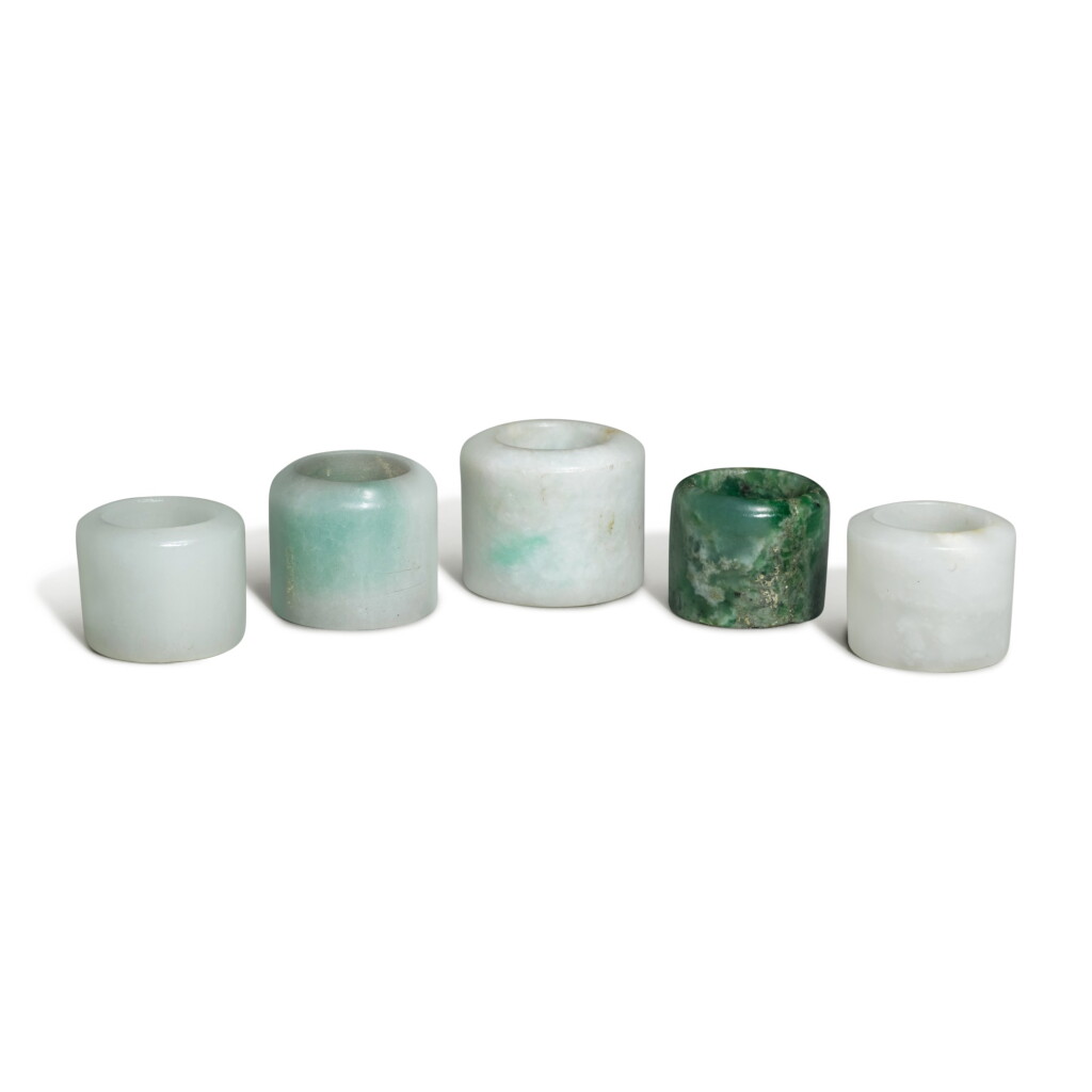 View full screen - View 1 of Lot 163. Five jade and jadeite archer's rings, 19th / 20th century.